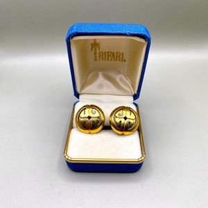 Vintage Crown Trifari Gilded Gold hardware clip-on earrings.